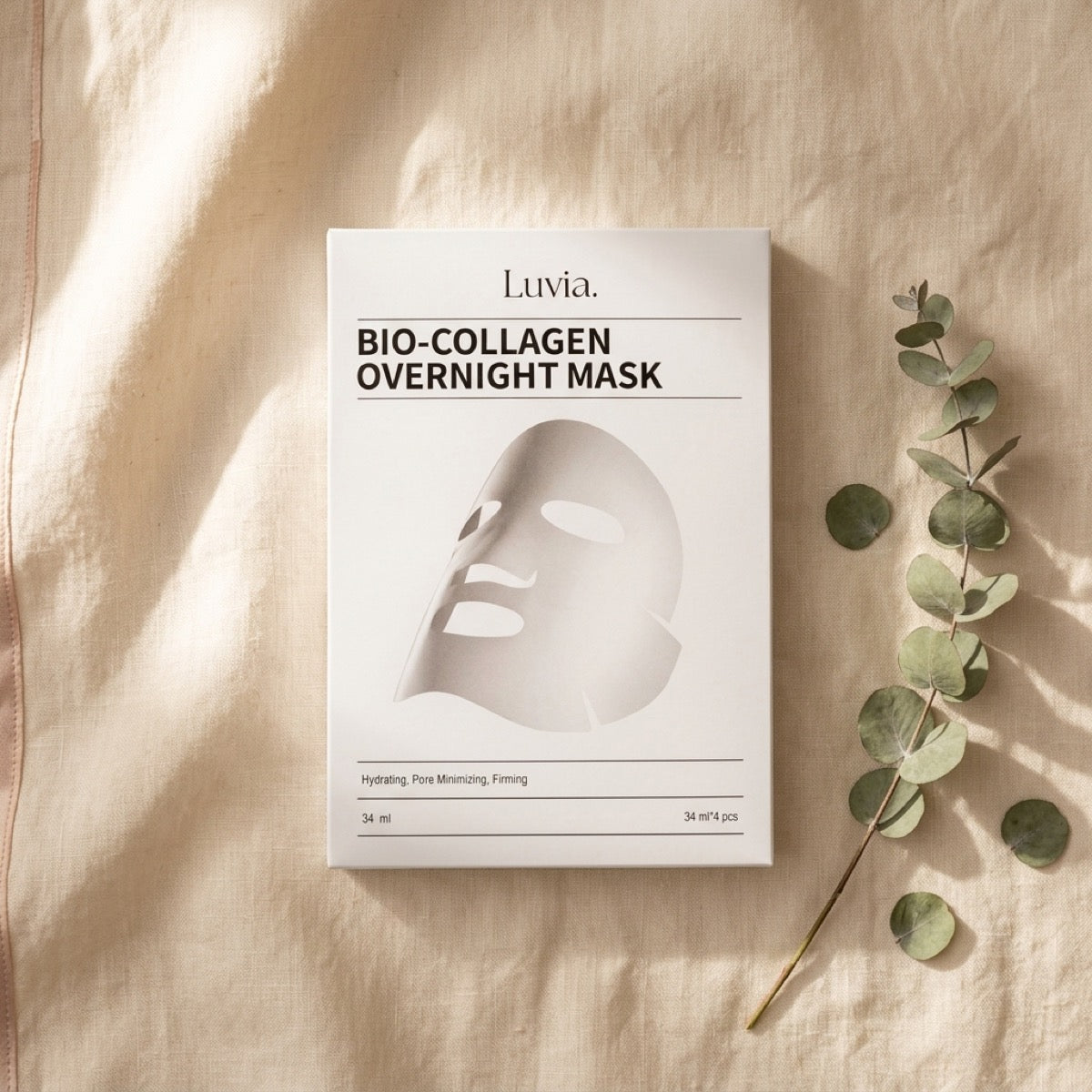 The mask carton flat on linen in morning light